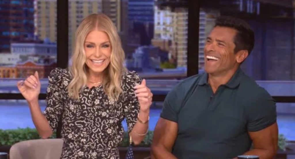 Kelly and Mark laughing on LIVE