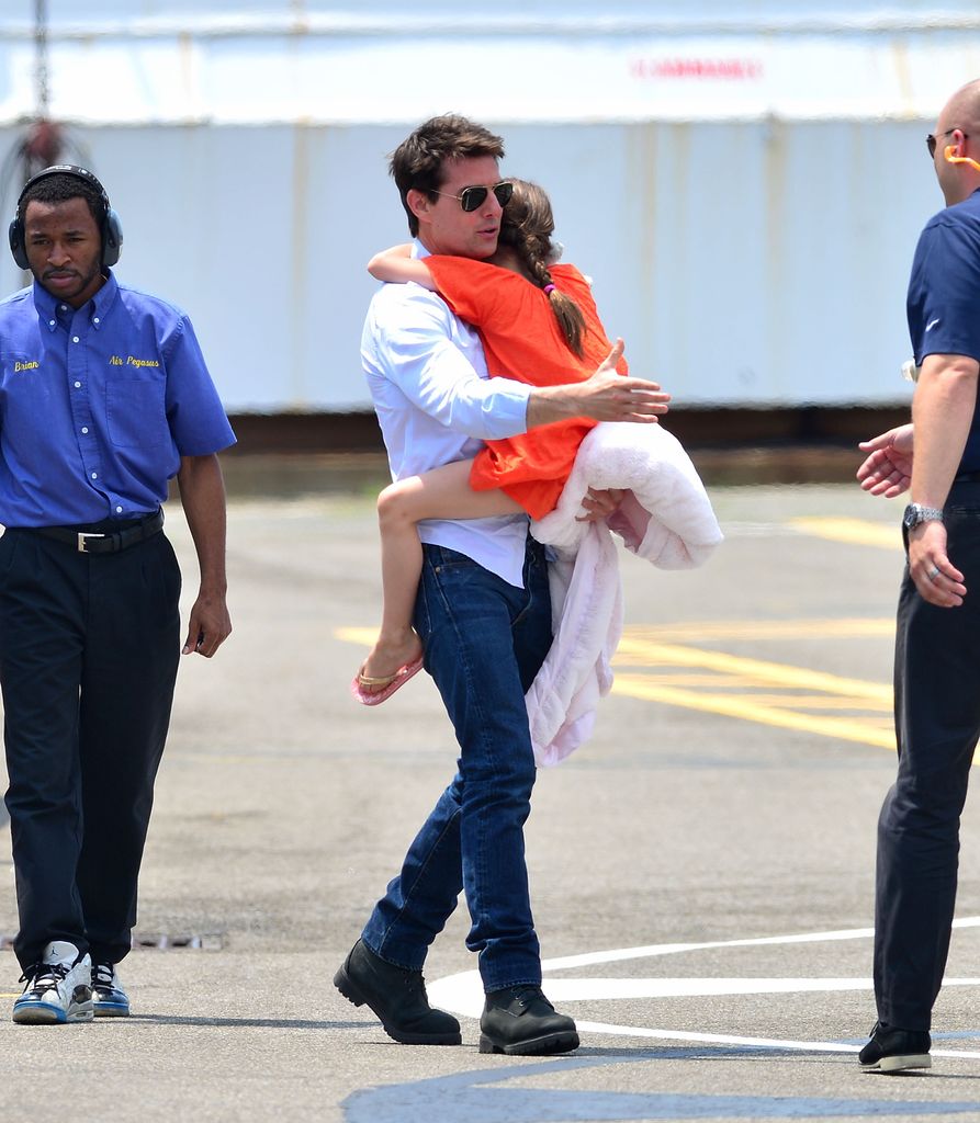 Tom Cruise and Suri Cruise leave Manhattan by helicopter at the West Side Heliport on July 18, 2012 in New York City