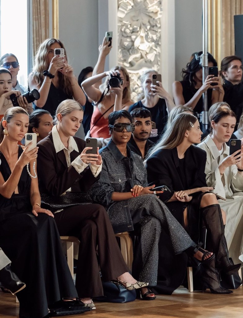 Jenee' Naylor sitting front row during Copenhagen Fashion Week