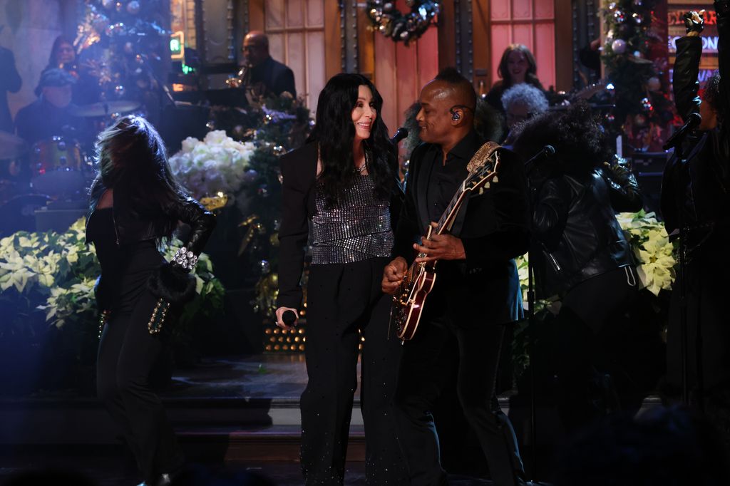 SATURDAY NIGHT LIVE -- Episode 1893 -- Pictured: (l-r) Musical guest Cher performs with guitarist "Captain" Kirk Douglas on Saturday, December 20, 2025