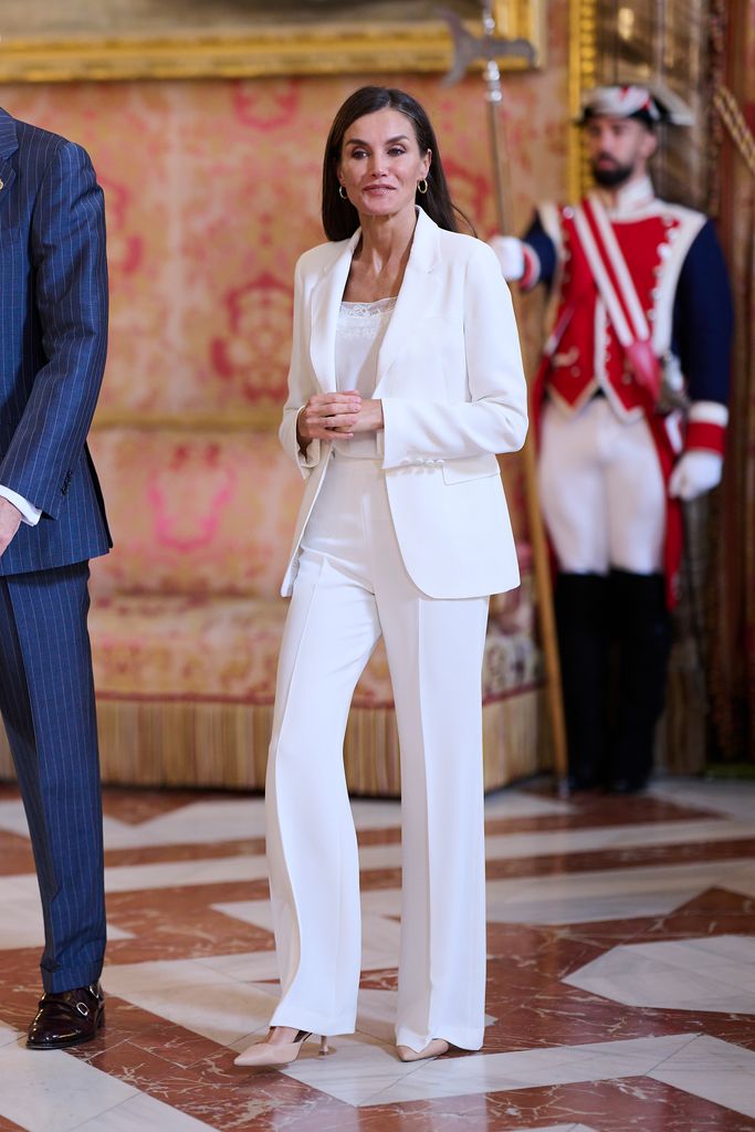 Queen Letizia wearing a white trouser suit