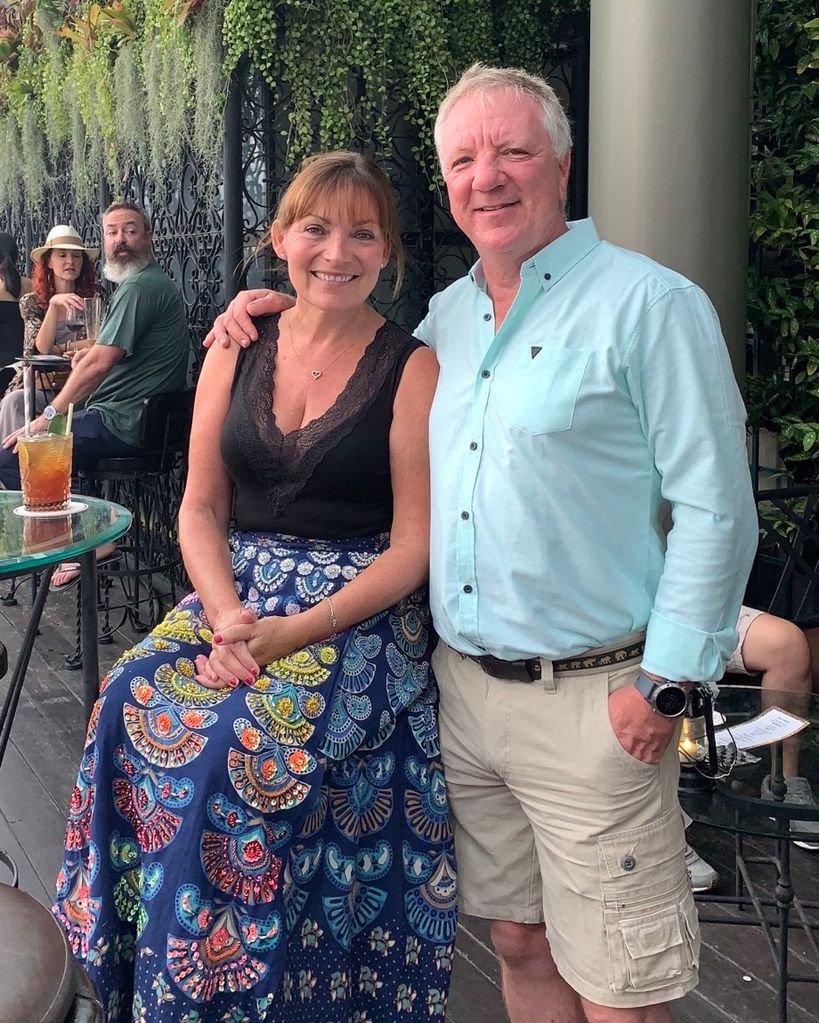 couple posing for photo in outdoor bar 