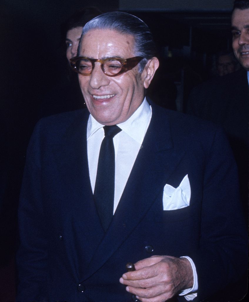 Aristotle Onassis smiling in a suit