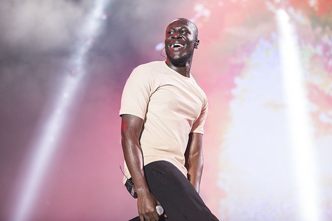 Stormzy smiles while on stage