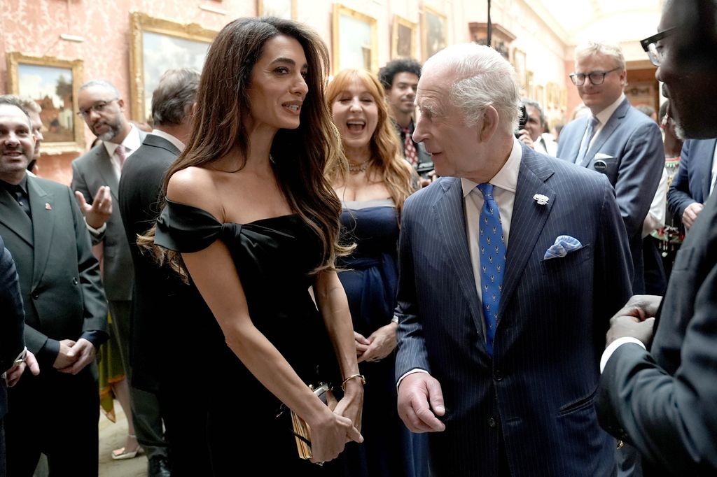 Amal Clooney speaks with King Charles
