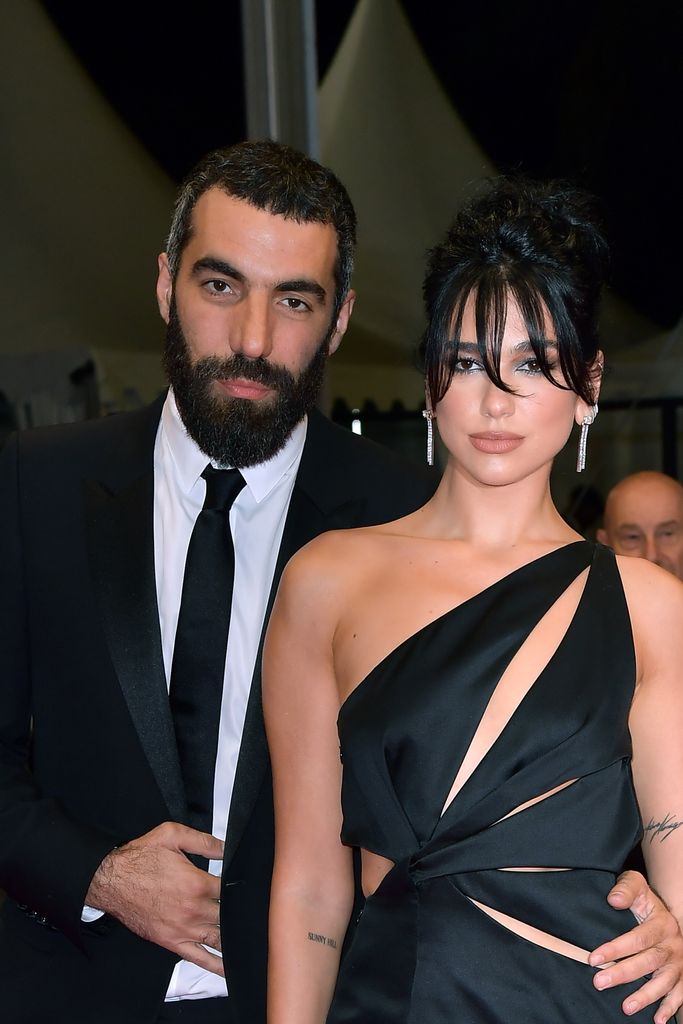 Dua Lipa and Romain Gavras attend the "Omar La Fraise (The King of Algiers)" red carpet during the 76th annual Cannes film festival at Palais des Festivals on May 19, 2023 in Cannes, France