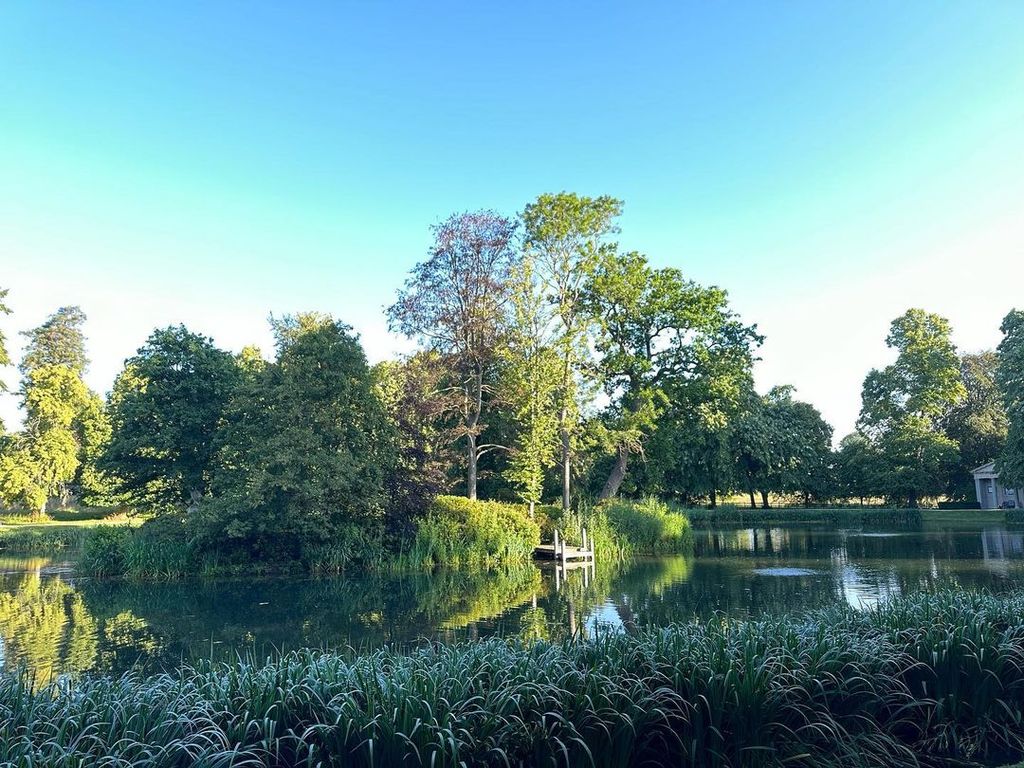 Charles Spencer's lake at Althorp House in the sunshine