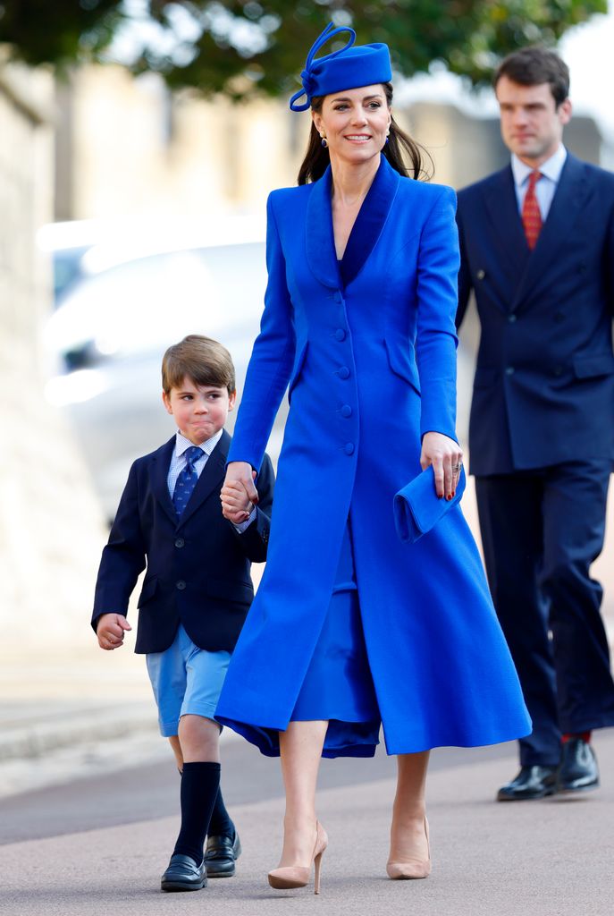 Kate Middleton wearing blue catherine walker coat holding prince louis hand easter mattins service
