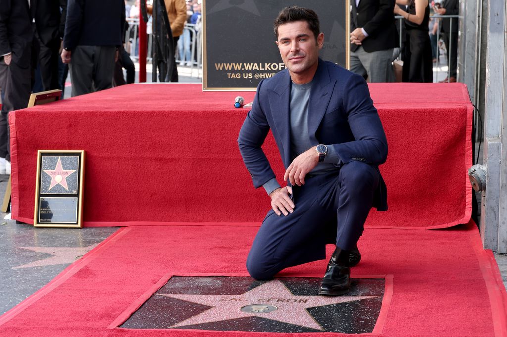 HOLLYWOOD, CALIFORNIA - DECEMBER 11: Zac Efron poses with his star during his Hollywood Walk of Fame Star Ceremony on December 11, 2023 in Hollywood, California. (Photo by Leon Bennett/Getty Images)