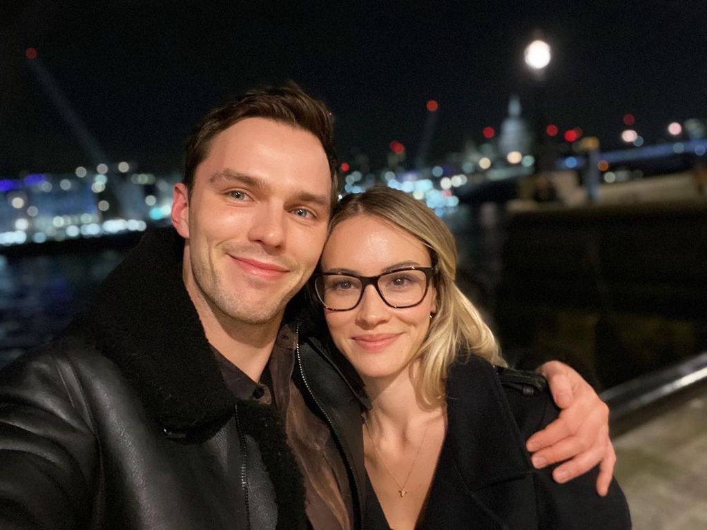 Nicholas Hoult and Bryana Holly posing for a selfie