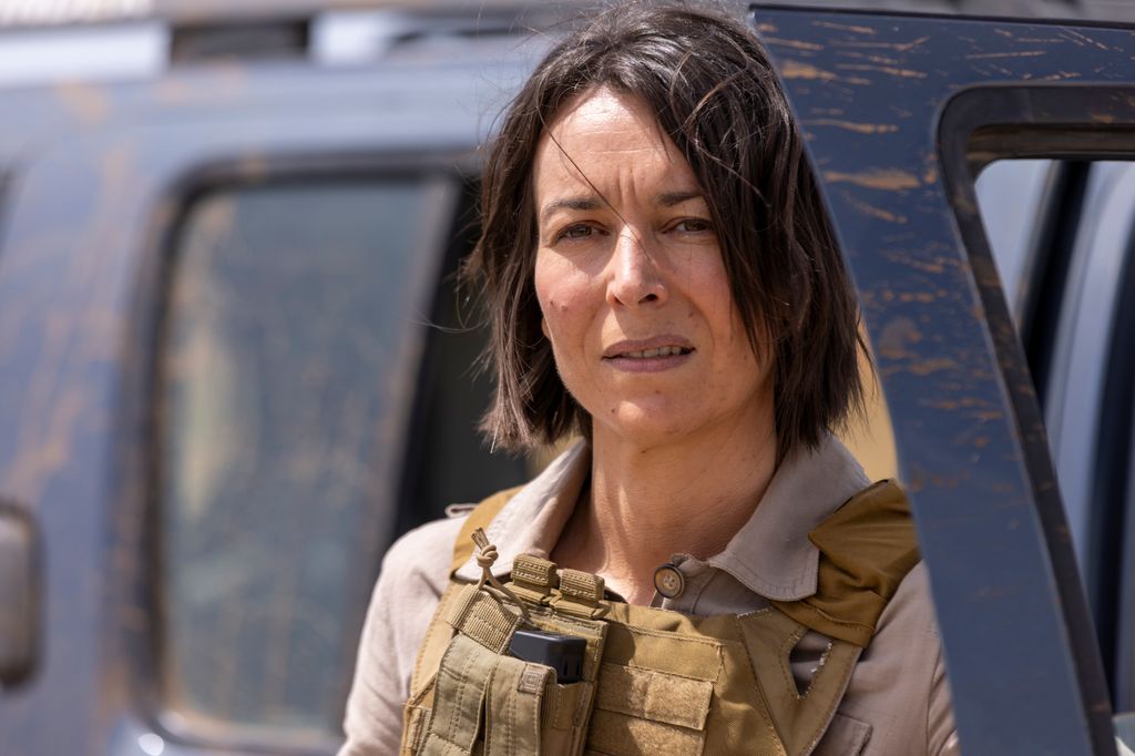 close-up brunette woman wearing protective vest