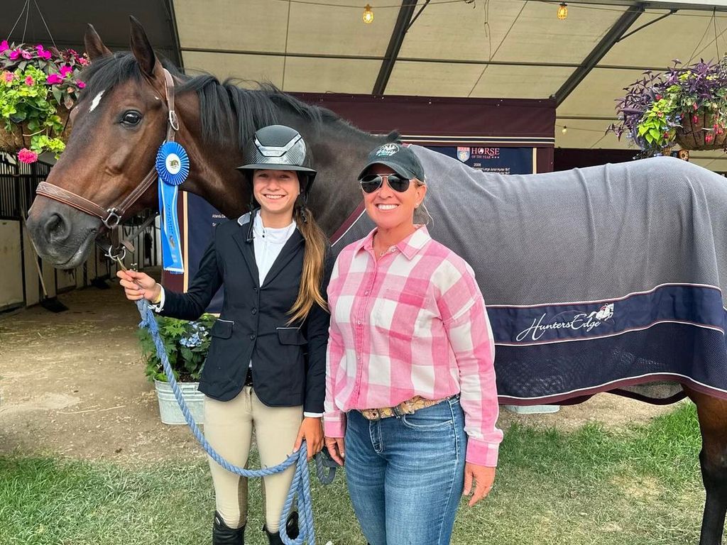 Grace Wahlberg poses with her horse after winning a blue ribbon, shared on Instagram