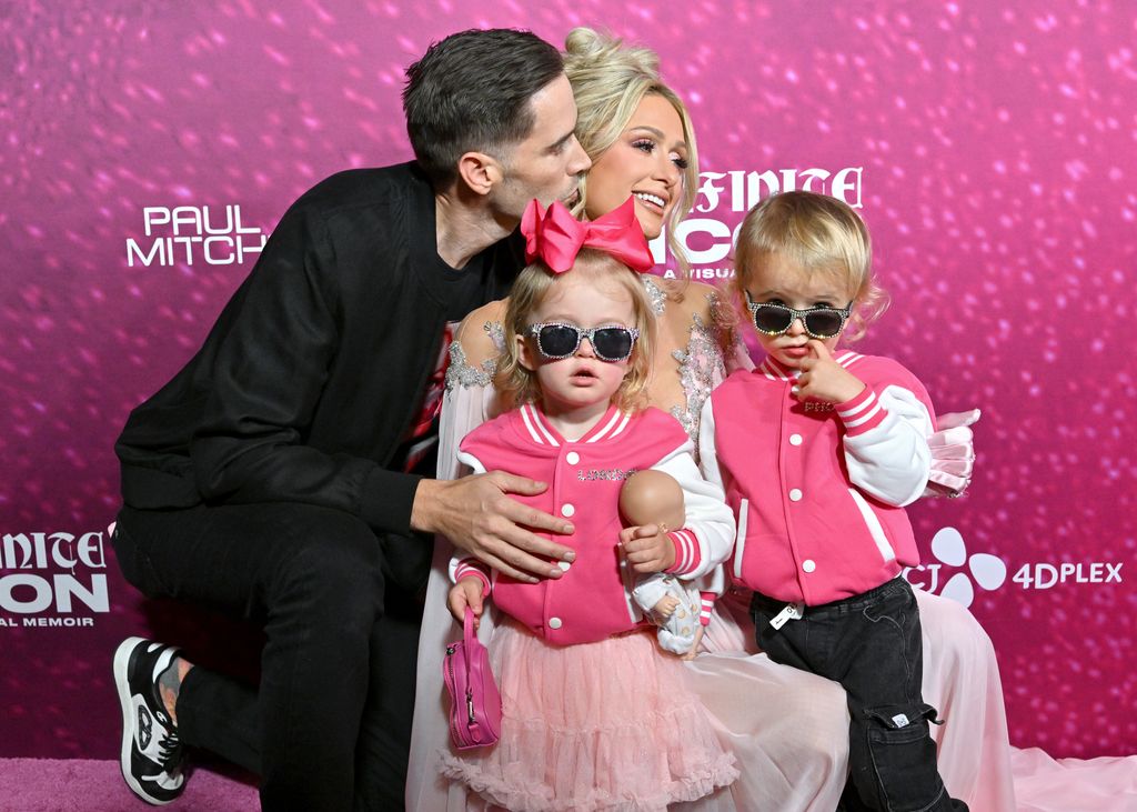 Carter Reum, London Marilyn Hilton Reum, Paris Hilton, and Phoenix Barron Hilton Reum attend the World Premiere of "Infinite Icon: A Visual Memoir" at AMC The Grove 14 on January 20, 2026 in Los Angeles, California