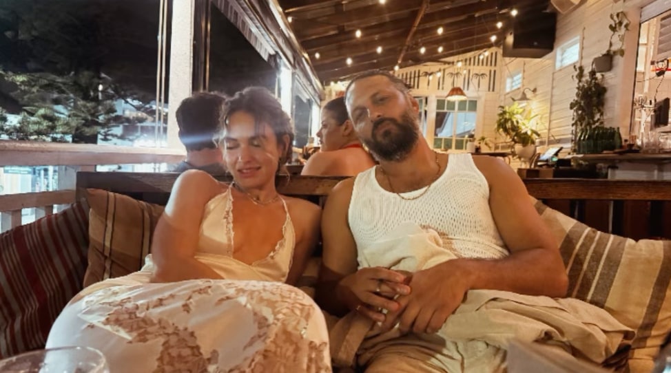 Lily James in lace-trimmed white dress crafted from silk 