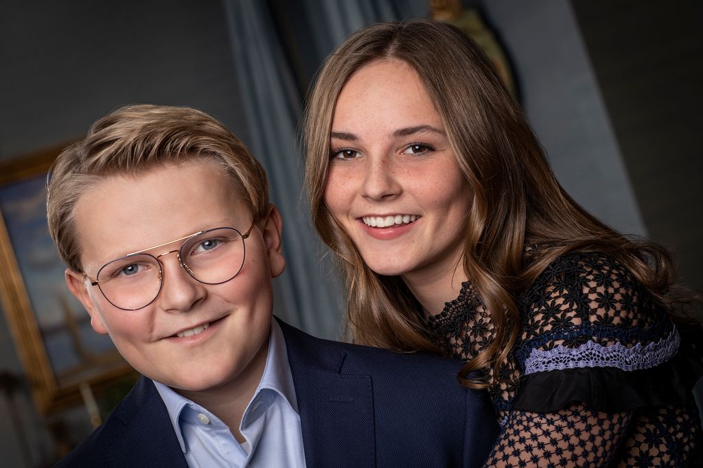 Princess Ingrid Alexandra with her arms around brother Sverre Magnus, with both of them smiling