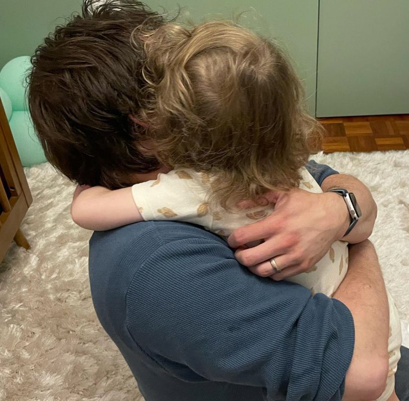 John Ritter hugging a young girl