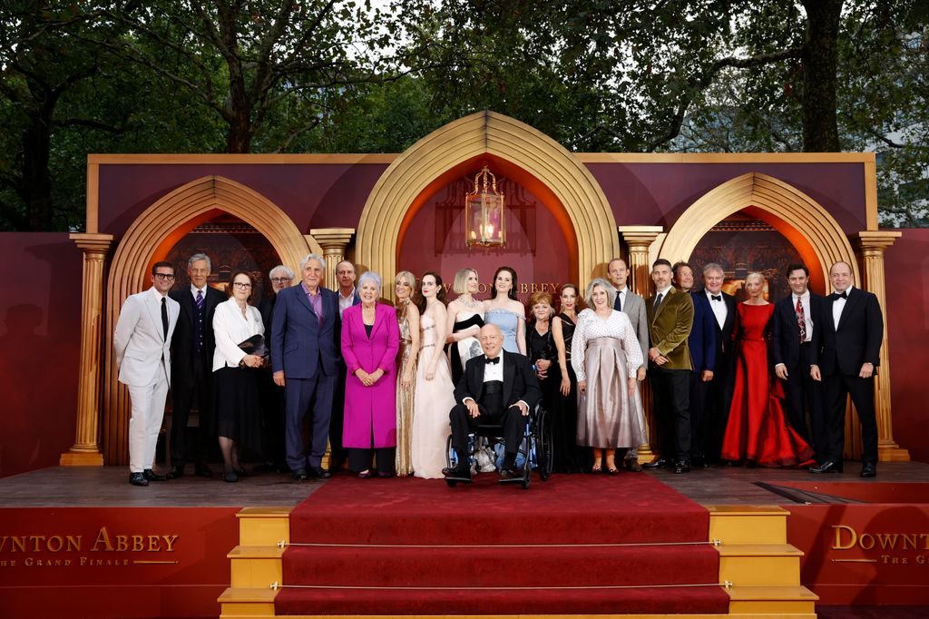 A photo of the Downton Abbey cast on red steps