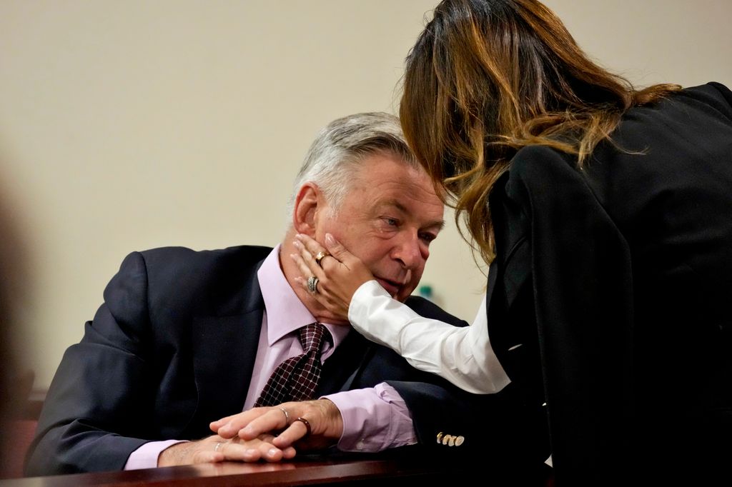 Alec Baldwin speaks with his wife Hilaria Baldwin during his hearing at Santa Fe County District Court on July 10, 2024 