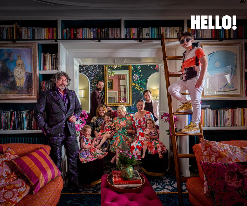 family posing in brightly coloured drawing room 