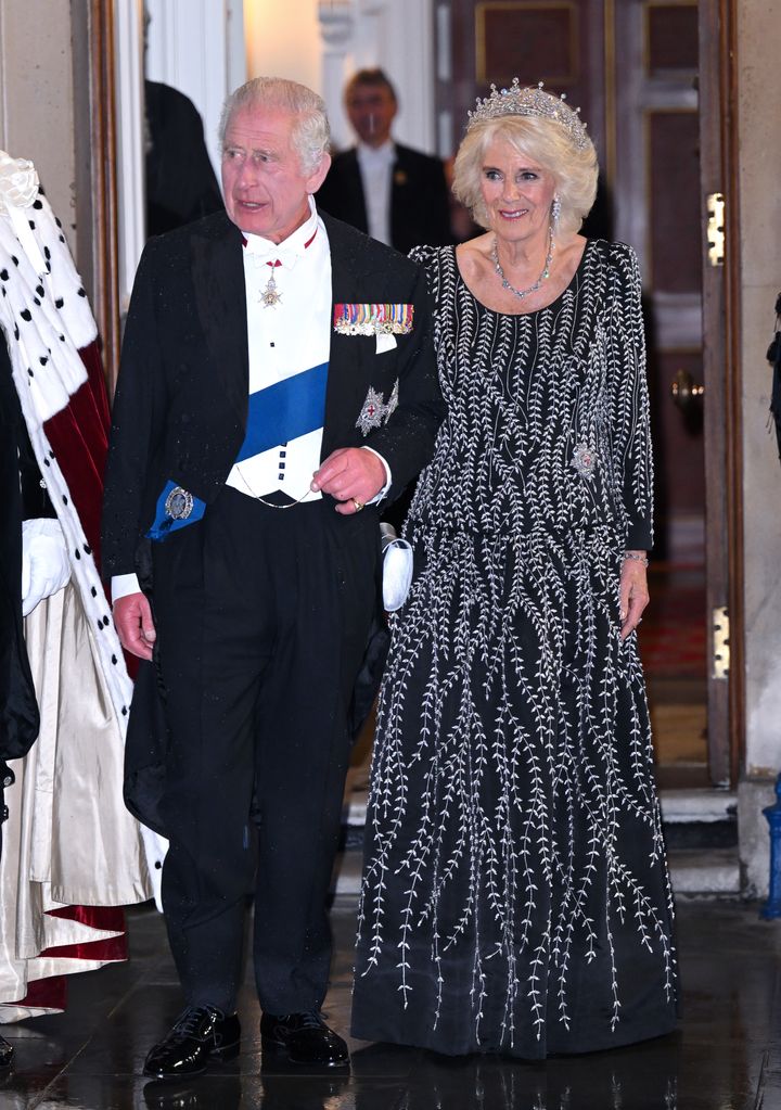 Queen Camilla and King Charles III arrive at a reception and dinner held at Mansion House on 18 October 2023