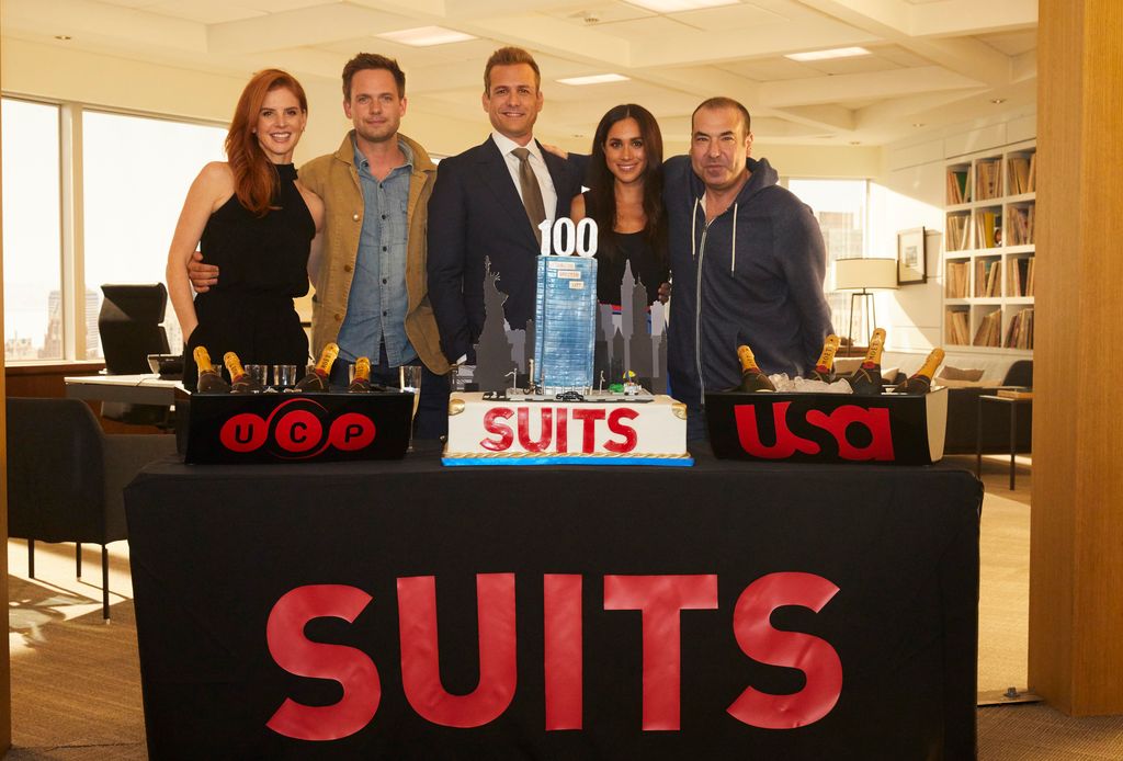 SUITS -- 100th Episode Celebration -- Pictured: (l-r) Sarah Rafferty, Patrick J. Adams, Gabriel Macht, Meghan Markle, Rick Hoffman -- (Photo by: Shane Mahood/USA Network/NBCU Photo Bank/NBCUniversal via Getty Images)