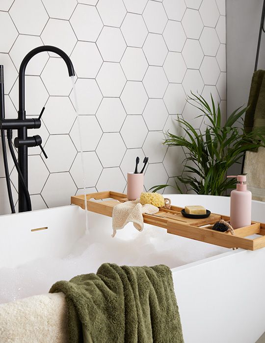 Dunelm Oval shaped bath with bath rack