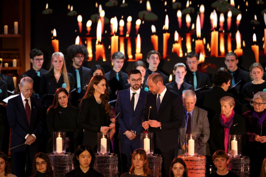  Catherine, Princess of Wales and Prince William, Prince of Wales light candles during a ceremony commemorating Holocaust Memorial Day