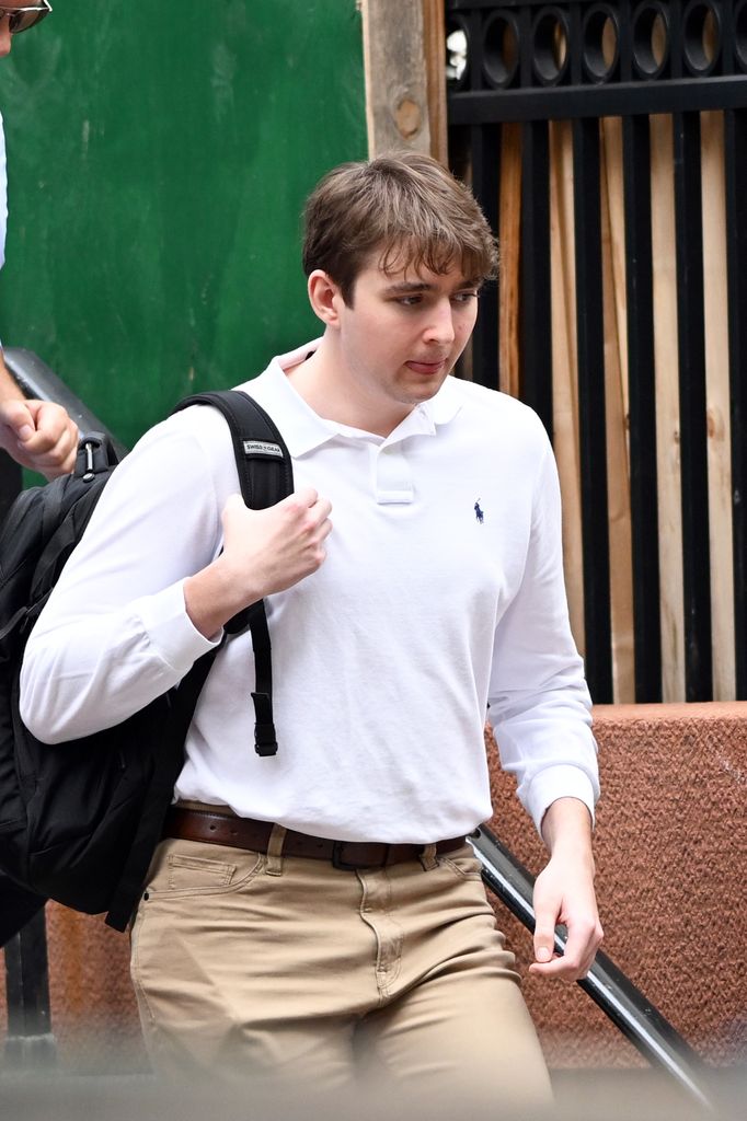Barron Trump in white polo shirt spotted leaving NYU