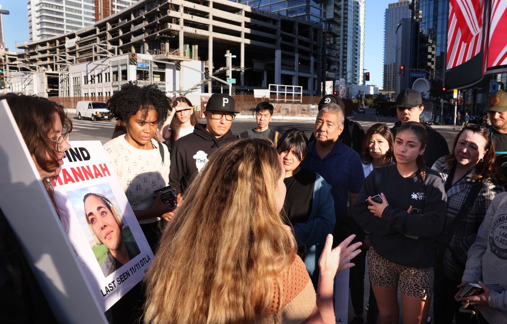 Volunteers organize as they prepare to hand out flyers of missing Maui woman Hannah Kobayashi outside Crypto.com Arena in Downtown Los Angeles Thursday, November 21, 2024