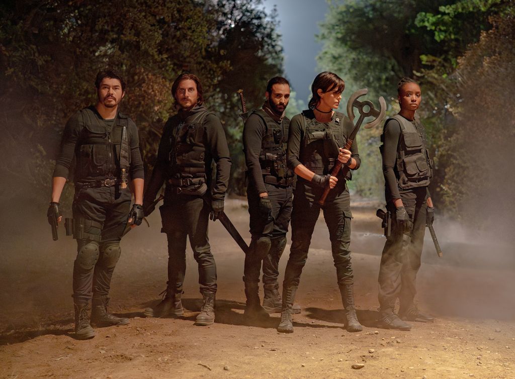 Henry Golding as Tuah, Luca Marinelli as Nicky, Marwan Kenzari as Joe, Charlize Theron as Andy and KiKi Layne as Nile in The Old Guard 2