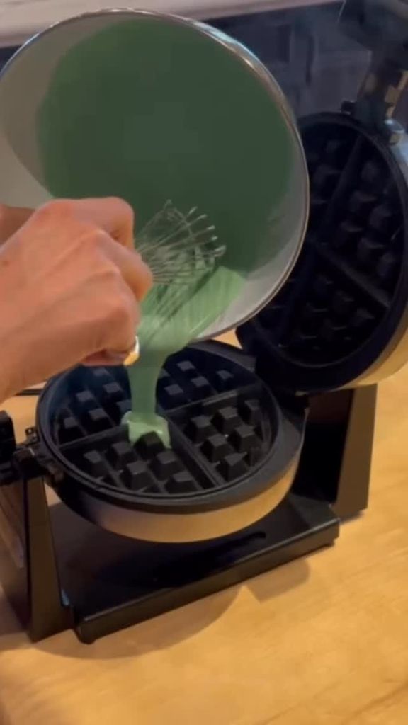 Meghan Markle pours green batter into her waffle maker in a video shared on her Instagram Stories