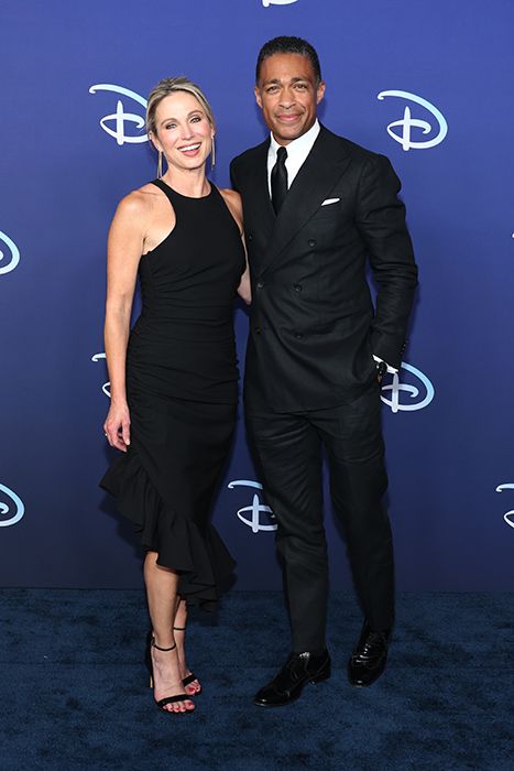 Amy Robach and T.J. Holmes posing together this year at a Disney event