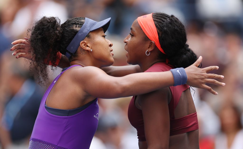 Naomi Osaka and Coco Gauff embrace following their match at the US Open