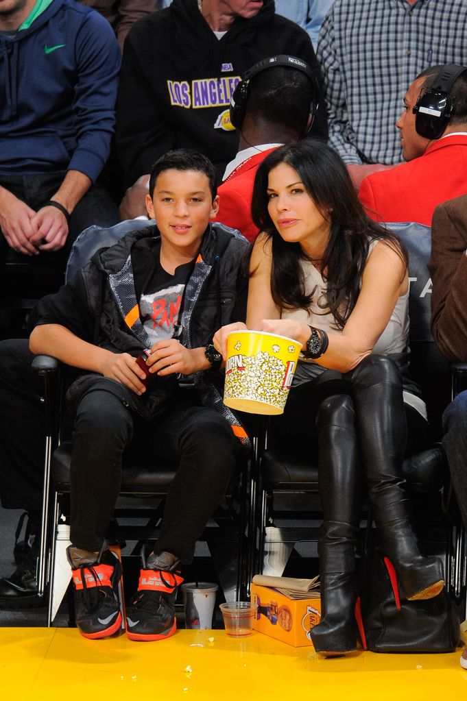 Lauren Sánchez and her son Nikko González attend a basketball game between the Indiana Pacers and the Los Angeles Lakers at Staples Center on January 28, 2014 in Los Angeles, California