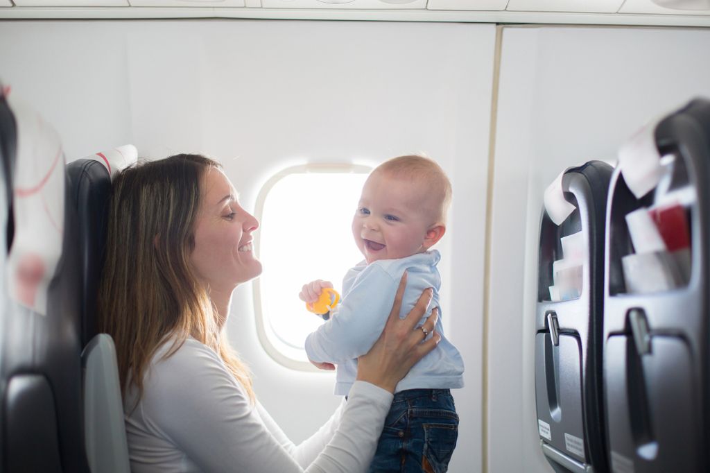 A mother and baby on a plane