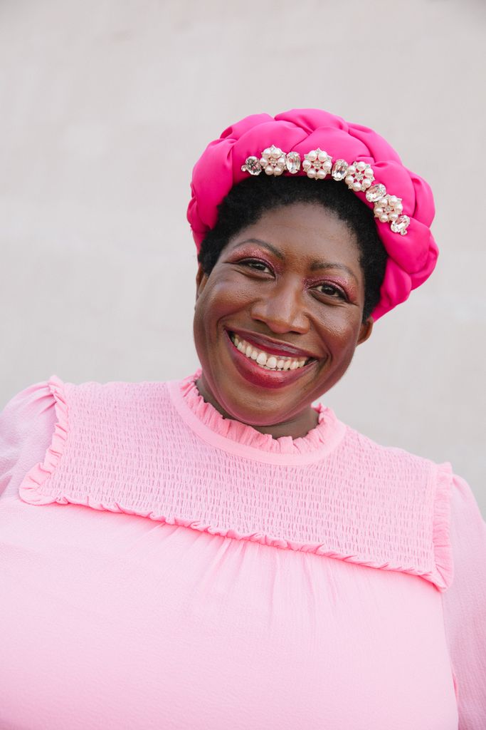 Ateh Jewel attends the 2023 BAFTA Television Awards in a pink hat and dress