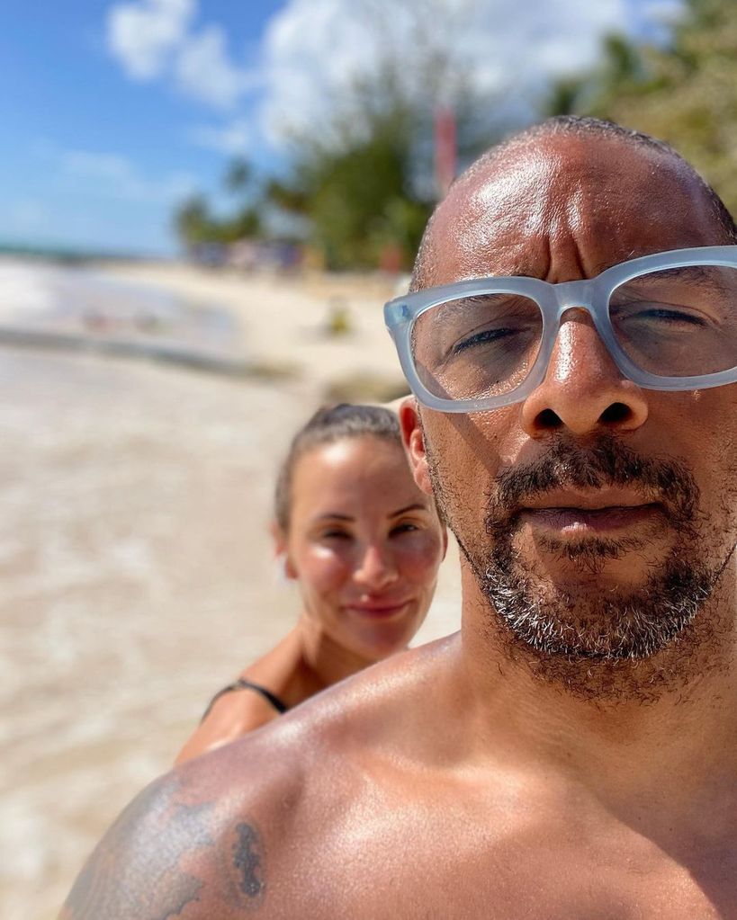 Jay Blades taking a selfie on the beach with his wife