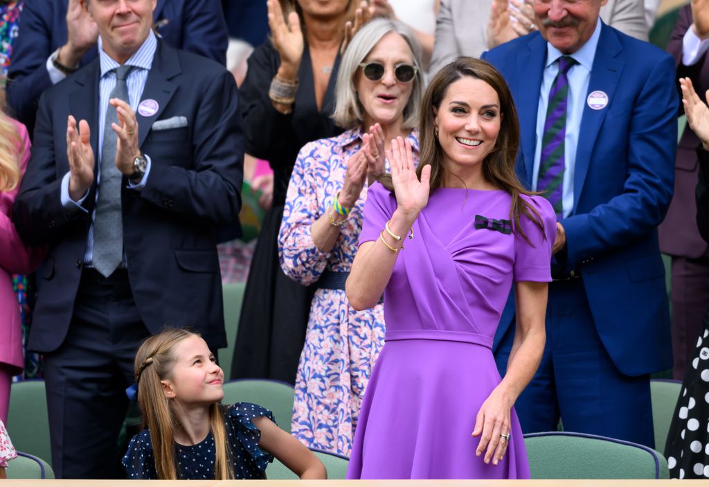Princess Charlotte looking up at kate waving