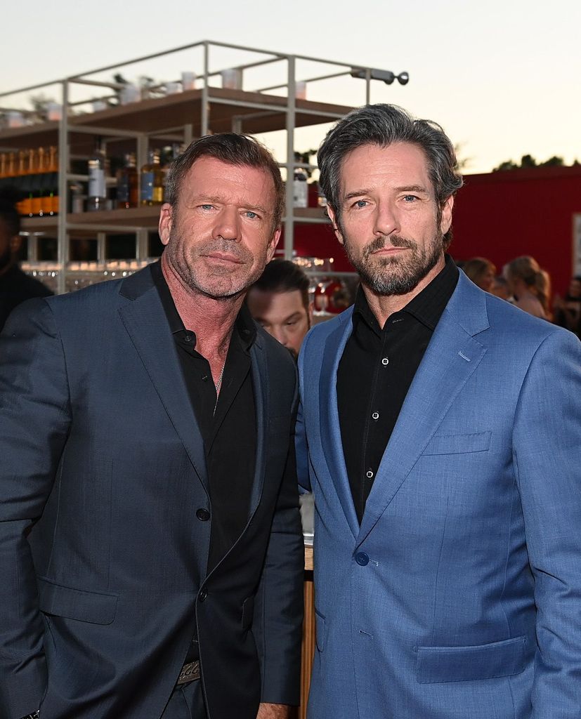 Taylor Sheridan and Ian Bohen attend amfAR Dallas Gala at Private Residence on October 04, 2025 in Dallas, Texas