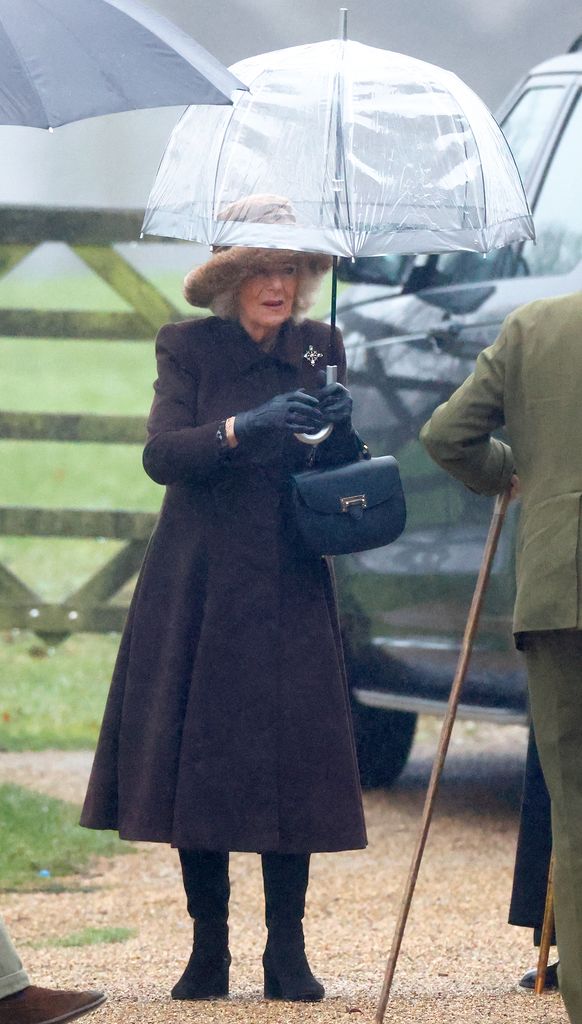 queen camilla attending church in rain with umbrella 