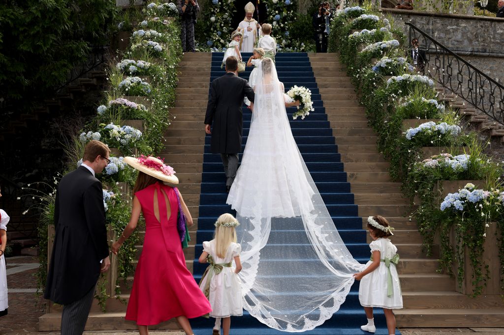 Alois, Hereditary Prince of Liechtenstein and Princess Marie Caroline Of Liechtenstein arrive at her wedding 