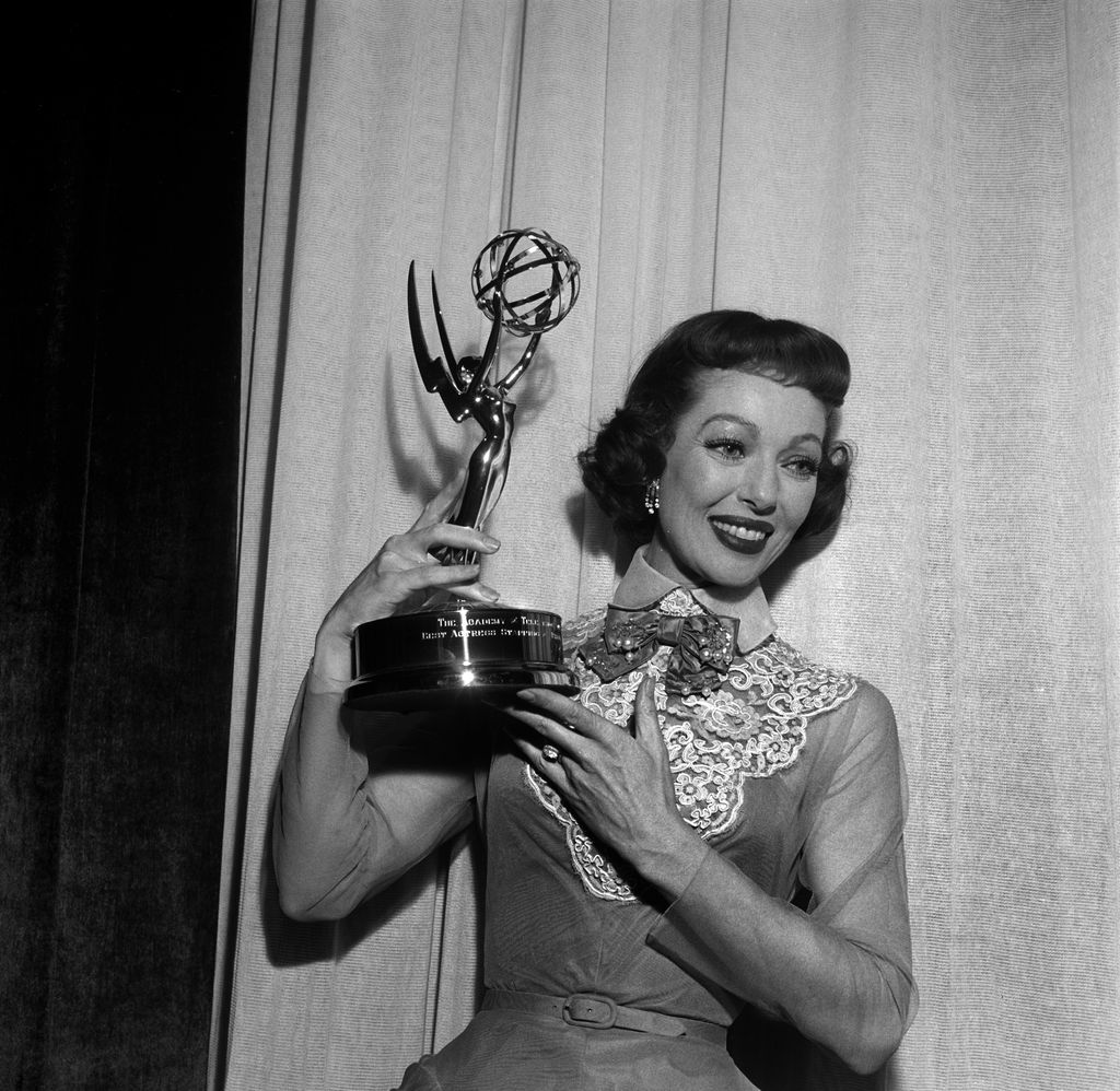 LOS ANGELES,CA - MARCH 7,1955: Actress Loretta Young poses with her Emmy Award for "The Loretta Young Show -1953 - 1961" during the 7th Primetime Emmy Awards in Los Angeles,CA. (Photo by Earl Leaf/Michael Ochs Archives/Getty Images)  