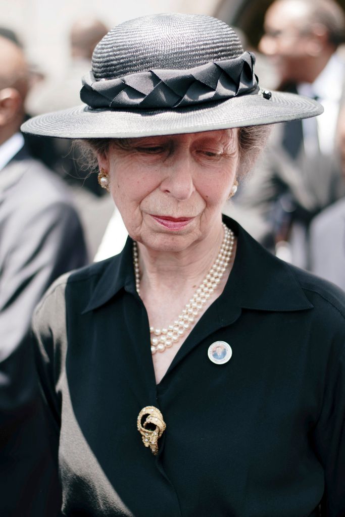 Princess Anne wearing black outfit, pearl jewellery