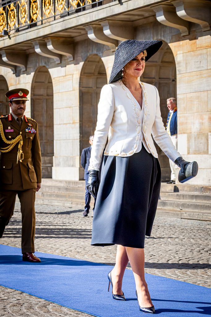 The royal paired the jacket with leather heels and black gloves 