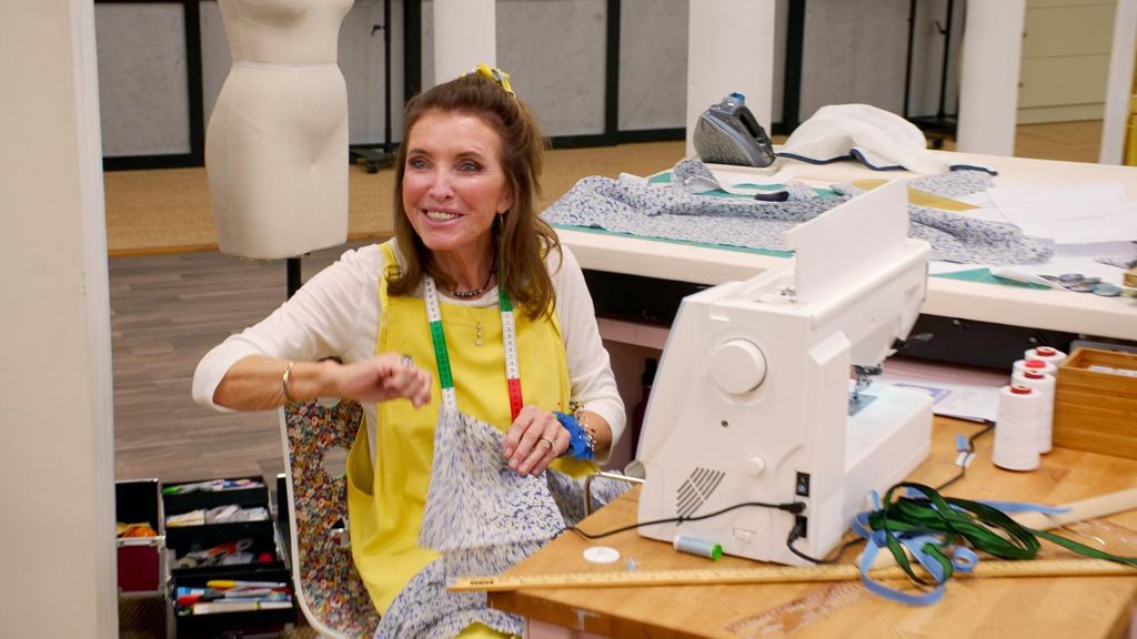 woman sitting at desk with sewing machine