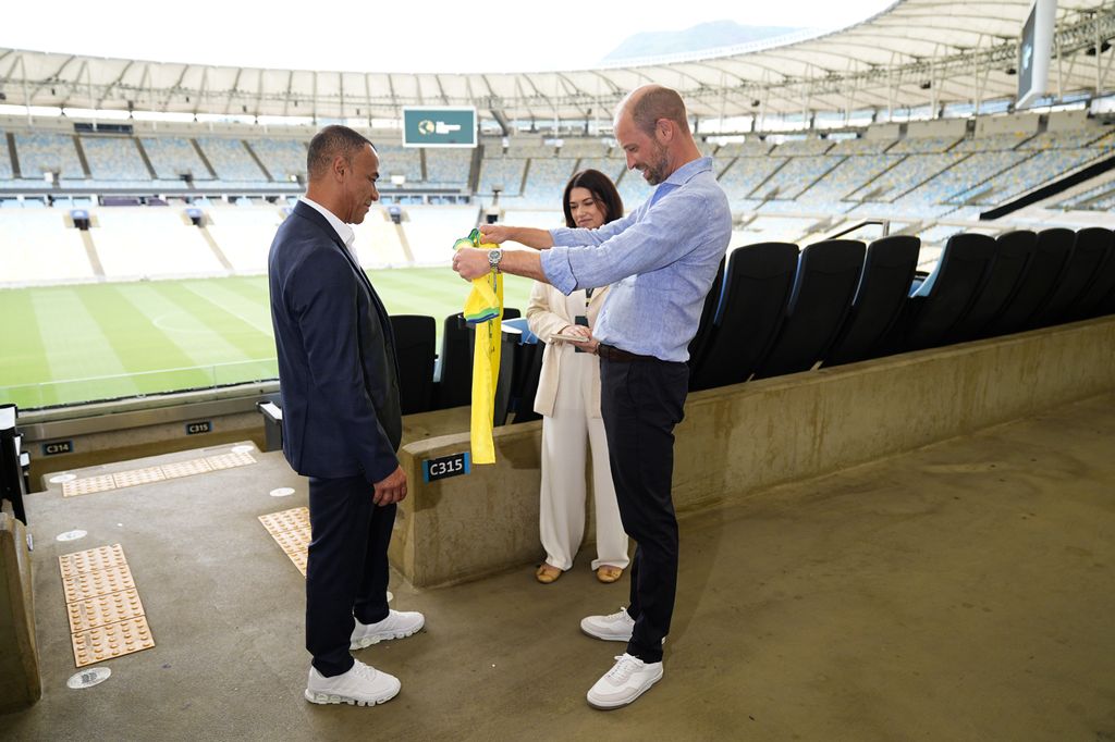 Prince William was presented with a signed football shirt by former Brazilian player Cafu.