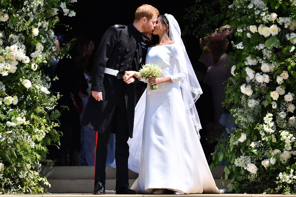 Prince Harry kisses his wife Meghan Markle following their royal wedding