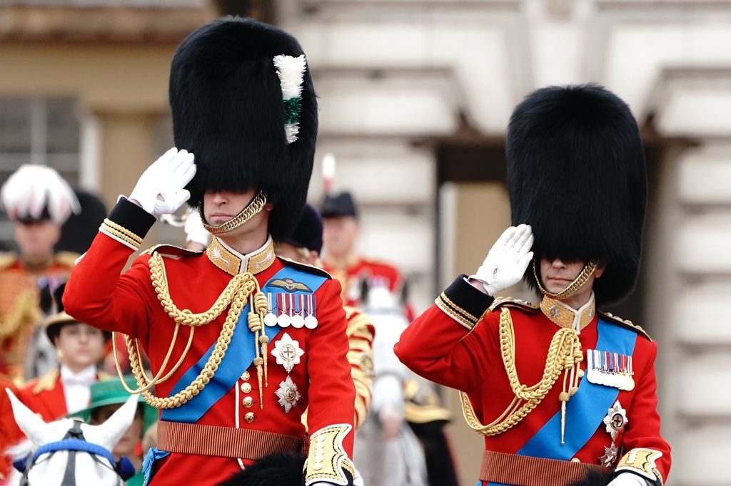 Prince William and Prince Edward salute as they depart Buckingham Palace for the Trooping the Colour ceremony