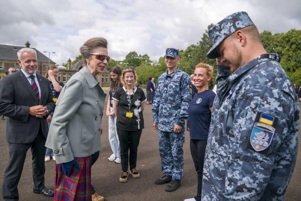 The Princess Royal meets members of the Ukrainian Navy Band during a rehearsal for this year's Royal Edinburgh Military Tattoo at Redford Barracks in Edinburgh. The Royal Edinburgh Military Tattoo is an annual series of military tattoos performed by British Armed Forces, Commonwealth and international military bands, and artistic performance teams on the Esplanade of Edinburgh Castle in the capital of Scotland. The event is held each August as one of the Edinburgh Festivals. Picture date: Wednesday July 30, 2025. (Photo by Jane Barlow/PA Images via Getty Images)