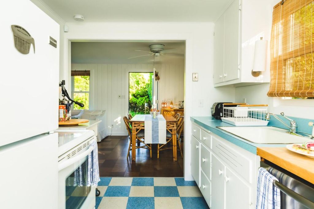Kitchen in home with checkered flooring 